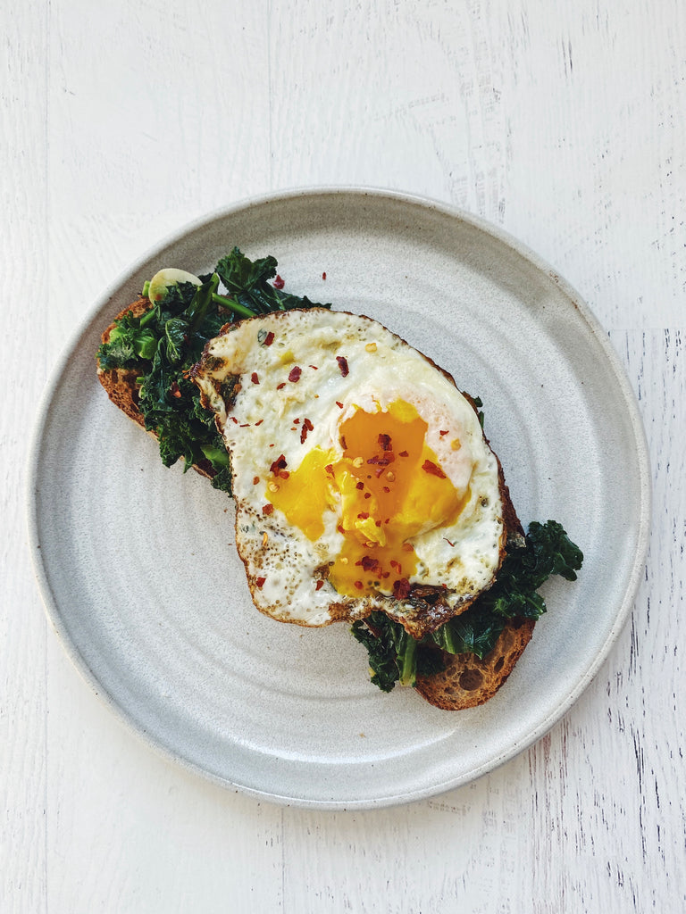 Garlicky kale, fried egg, & pecorino on sourdough