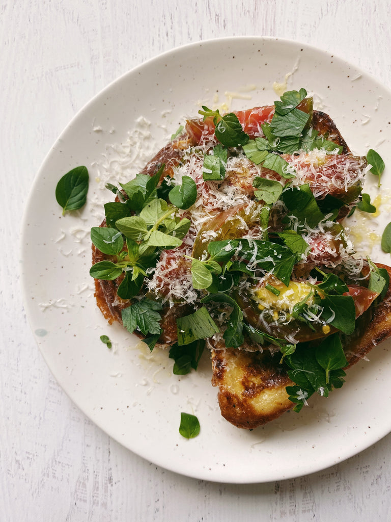 Savory french toast with tomatoes, parmesan, and herbs